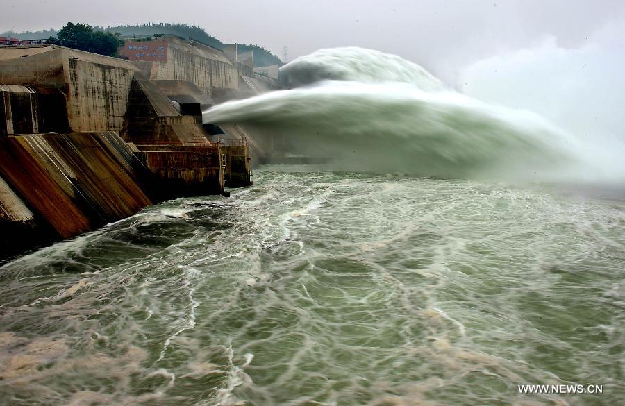 Water gushes out of the Xiaolangdi Reservoir on the Yellow River during a water and sediment regulating operation in Sanmenxia City of central China's Henan Province, June 22, 2013. The water and sediment regulating operation of Xiaolangdi Reservoir is conducted every year to clear out the mud and sand accumulated at the dam. (Xinhua/Wang Song) 