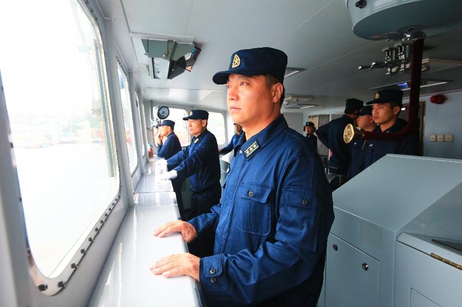 Zhang Changlong, captain of commander ship "Shenyang" of Chinese Navy vessels attending joint naval drills, is seen during the exercises near Vladivostok, Russia, July 8, 2013. China and Russia started on Monday the joint naval drills off the coast of Russia's Far East. (Xinhua/Zha Chunming)  