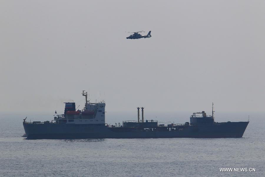 A Chinese ship-borne helicopter attends the exercise of rescue of hijacked vessel during the "Joint Sea-2013" drill at Peter the Great Bay in Russia, July 9, 2013. Chinese and Russian warships carried out a variety of exercises including joint air defense, maritime supply, joint escort and the rescue of hijacked vessels during the second day of "Joint Sea-2013" drill. (Xinhua/Zha Chunming)