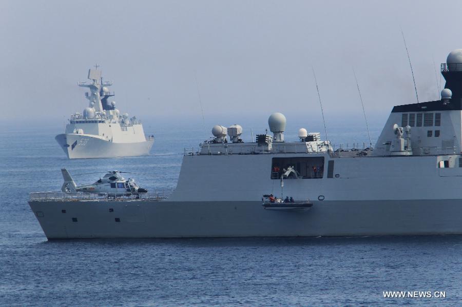 Chinese naval vessel attends the exercise of rescue of hijacked vessel during the "Joint Sea-2013" drill at Peter the Great Bay in Russia, July 9, 2013. Chinese and Russian warships carried out a variety of exercises including joint air defense, maritime supply, joint escort and the rescue of hijacked vessels during the second day of "Joint Sea-2013" drill. (Xinhua/Zha Chunming)