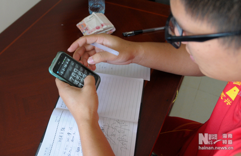 Li Daning is the only worker in Sansha experiment stations of Chinese Academy of Sciences. He logs the daily expenses carefully although he is the only one in the experiment stations. (Xinhua/Yu Tao)