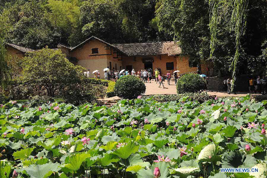 Tourists visit the Former Residence of Chairman Mao Zedong located in Shaoshan Township of Xiangtan City, central China's Hunan Province, July 19, 2013. This year marks the 120th Anniversary of Mao Zedong's Birth, many tourists come to the Former Residence of Chairman Mao Zedong which is a national site for patriotic education.(Xinhua/He Changjun)