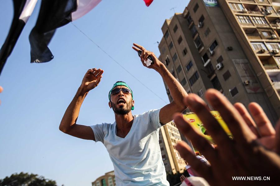 Supporters of Egypt's ousted President Mohamed Morsi take part in a protest in Rabaa Al-Adaweya Square for the 29th day in row, Cairo, July 26, 2013. A top Egyptian court has ordered the detention of ousted Islamist-oriented President Mohamed Morsi for 15 days for investigations over charges of spying and jailbreak, official media reported Friday. (Xinhua/Amru Salahuddien) 