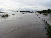 Villages flooded due to embankment breach on Heilong River