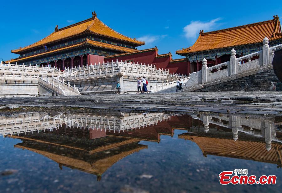 Charming mirror scene of Palace Museum after rain