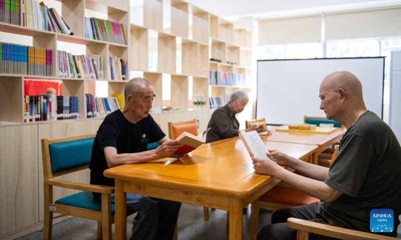 Senior residents read at a nursing home in Hanshou County of Changde City, central China's Hunan Province, June 20, 2023. The city of Changde has scaled up efforts to develop an elderly care service system composed mainly of in-home cares, community services, institutional and medical cares. (Xinhua/Chen Sihan)